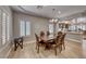 This dining room features a wood table, leather chairs, and plantation shutters at 3001 Walnut Park Ct, Henderson, NV 89052