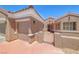 Stunning exterior of single-story home with a well-maintained garage and courtyard entrance with gate at 3001 Walnut Park Ct, Henderson, NV 89052