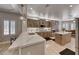Gourmet kitchen featuring stainless steel appliances, large island, bright countertops, and light wood cabinets at 3001 Walnut Park Ct, Henderson, NV 89052