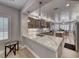 Gourmet kitchen featuring stainless steel appliances, large island, bright countertops and light wood cabinets at 3001 Walnut Park Ct, Henderson, NV 89052