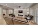 Modern living room with fireplace, custom shelving, and light wood flooring for a bright living space at 3001 Walnut Park Ct, Henderson, NV 89052