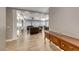 Bright open-concept living room with fireplace, built-in shelves, and views of the living and dining area at 3001 Walnut Park Ct, Henderson, NV 89052
