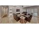Spacious living room with luxury vinyl floors, custom shelving, fireplace, and views of backyard at 3001 Walnut Park Ct, Henderson, NV 89052