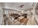 Open concept floor plan integrating the living room, dining area, and kitchen with light filled living space at 3001 Walnut Park Ct, Henderson, NV 89052