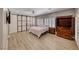Spacious main bedroom with unique sliding barn door, closet, and bright light from the window at 3001 Walnut Park Ct, Henderson, NV 89052