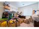 Cluttered room featuring clothes racks, storage bins and boxes of garments at 3553 Judson Ave, Las Vegas, NV 89115