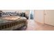 Comfortable bedroom with neutral carpet and a glimpse into an en-suite bathroom at 3553 Judson Ave, Las Vegas, NV 89115