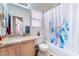 Cozy bathroom with granite vanity, bathtub, and decorative shower curtain at 4542 Silver Bit Ct, North Las Vegas, NV 89032