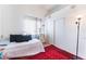 White bedroom featuring a decorative rug, a cat stand, and a lamp at 4542 Silver Bit Ct, North Las Vegas, NV 89032