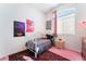 Bedroom with natural light, a rug, and posters at 4542 Silver Bit Ct, North Las Vegas, NV 89032