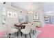 Elegant dining room featuring a wooden table, six chairs, and bright lighting at 4542 Silver Bit Ct, North Las Vegas, NV 89032