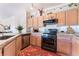 Modern kitchen featuring stainless steel appliances, granite countertops, and ample cabinet space at 4542 Silver Bit Ct, North Las Vegas, NV 89032