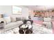 Inviting living room with a comfortable sofa and seamless flow to the kitchen at 4542 Silver Bit Ct, North Las Vegas, NV 89032