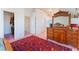 Bedroom with an ornate wooden dresser and a rug at 4542 Silver Bit Ct, North Las Vegas, NV 89032