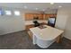 Well-appointed kitchen with stainless steel appliances, tile countertops, and ample cabinet space at 7572 Coyote Cave Ave, Las Vegas, NV 89113