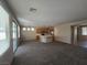 Spacious living room boasts an open layout and a kitchen with modern appliances at 7572 Coyote Cave Ave, Las Vegas, NV 89113