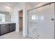 Bathroom with shower and dark wood vanity at 860 Echelon St, Las Vegas, NV 89138
