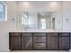 Modern bathroom featuring double vanity with dark wood cabinets and bright white countertop at 860 Echelon St, Las Vegas, NV 89138