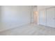 Cozy bedroom featuring neutral carpet, white trim, and closet at 860 Echelon St, Las Vegas, NV 89138