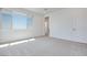 Light-filled bedroom with neutral carpet and an en-suite bathroom at 860 Echelon St, Las Vegas, NV 89138
