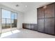 Bright dining area with large sliding glass doors to patio, dark wood cabinets for ample storage at 860 Echelon St, Las Vegas, NV 89138