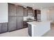 Modern kitchen boasts gray cabinets, stainless steel appliances, and a sleek quartz island at 860 Echelon St, Las Vegas, NV 89138