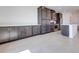 Spacious kitchen showcasing ample dark wood cabinetry, stainless appliances and a large center island at 860 Echelon St, Las Vegas, NV 89138