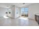 Open living room with large windows and sliding glass door, providing ample light and backyard access at 860 Echelon St, Las Vegas, NV 89138