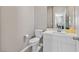 Bathroom features a white vanity with a framed mirror and modern fixtures at 949 Bayberry Ridge St, Henderson, NV 89052