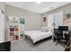 Cozy bedroom featuring a comfortable bed, shelving, and a desk workspace at 949 Bayberry Ridge St, Henderson, NV 89052