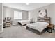 Bright bedroom featuring two beds, a vanity, and a neutral color scheme at 949 Bayberry Ridge St, Henderson, NV 89052