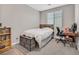 Comfortable bedroom featuring a bed, desk, and ample natural light at 949 Bayberry Ridge St, Henderson, NV 89052