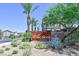 Rose Ridge by Lennar community entrance featuring lush desert landscaping and palm trees at 949 Bayberry Ridge St, Henderson, NV 89052
