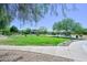 Beautiful community park with lush green grass and mature trees, perfect for recreation at 949 Bayberry Ridge St, Henderson, NV 89052