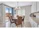Cozy dining area with access to the backyard, complemented by stylish lighting and modern finishes at 949 Bayberry Ridge St, Henderson, NV 89052