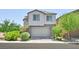 Charming two-story home with a stone facade and attached two-car garage in a well-maintained neighborhood at 949 Bayberry Ridge St, Henderson, NV 89052