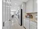 Bright kitchen features stainless steel appliances, white cabinets and granite countertops at 949 Bayberry Ridge St, Henderson, NV 89052