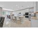 Modern kitchen features white cabinetry, granite countertops, stainless steel appliances, and a breakfast bar at 949 Bayberry Ridge St, Henderson, NV 89052