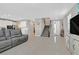 Spacious living room featuring glossy tile floors and an open floor plan, bathed in natural light at 949 Bayberry Ridge St, Henderson, NV 89052