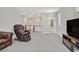 Spacious loft area with neutral walls, plush carpeting, and plenty of natural light at 949 Bayberry Ridge St, Henderson, NV 89052
