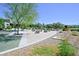 Community playground featuring sand area with concrete benches surrounded by young trees at 949 Bayberry Ridge St, Henderson, NV 89052