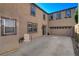 Home with concrete patio and tan stucco exterior at 165 Calm Morning Ave, Henderson, NV 89002
