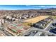 An aerial view of community basketball courts, a sandlot and the neighborhood homes at 2120 Waterlily View St, Henderson, NV 89044