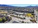 Aerial view of the community showing the tennis courts, neighborhood, and mountain backdrop at 2120 Waterlily View St, Henderson, NV 89044