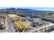 Community aerial view featuring a ' playground, green spaces and nearby housing under a clear sky at 2120 Waterlily View St, Henderson, NV 89044