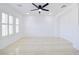 Bright, spacious room featuring tile floors, modern lighting, and bright white walls at 2120 Waterlily View St, Henderson, NV 89044