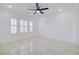 Bright, spacious room featuring tile floors, modern lighting, and bright white walls at 2120 Waterlily View St, Henderson, NV 89044