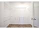Walk-in closet with rod and wire shelving for optimal storage and organization at 2120 Waterlily View St, Henderson, NV 89044