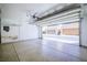 Spacious garage with epoxy floors, overhead storage, and automatic door at 2120 Waterlily View St, Henderson, NV 89044