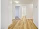 Hallway featuring wood floors and access to other rooms at 2120 Waterlily View St, Henderson, NV 89044